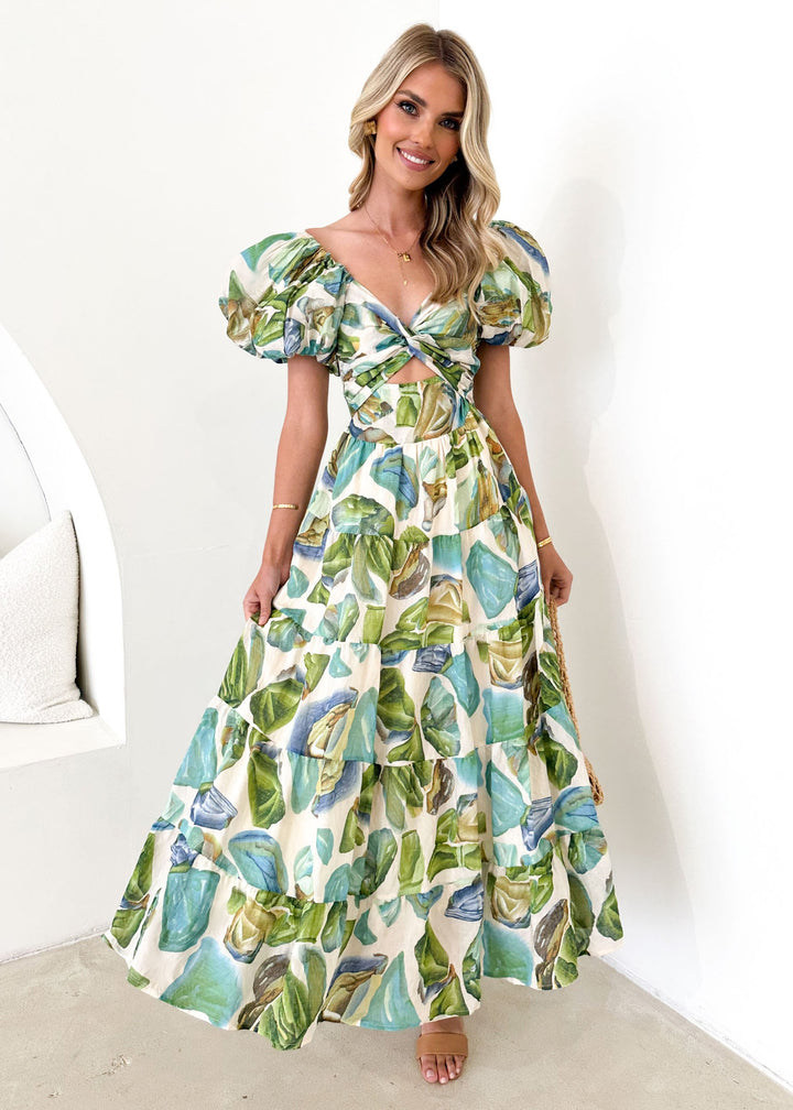 Women's maxi dress with voluminous puff sleeves and floral pattern