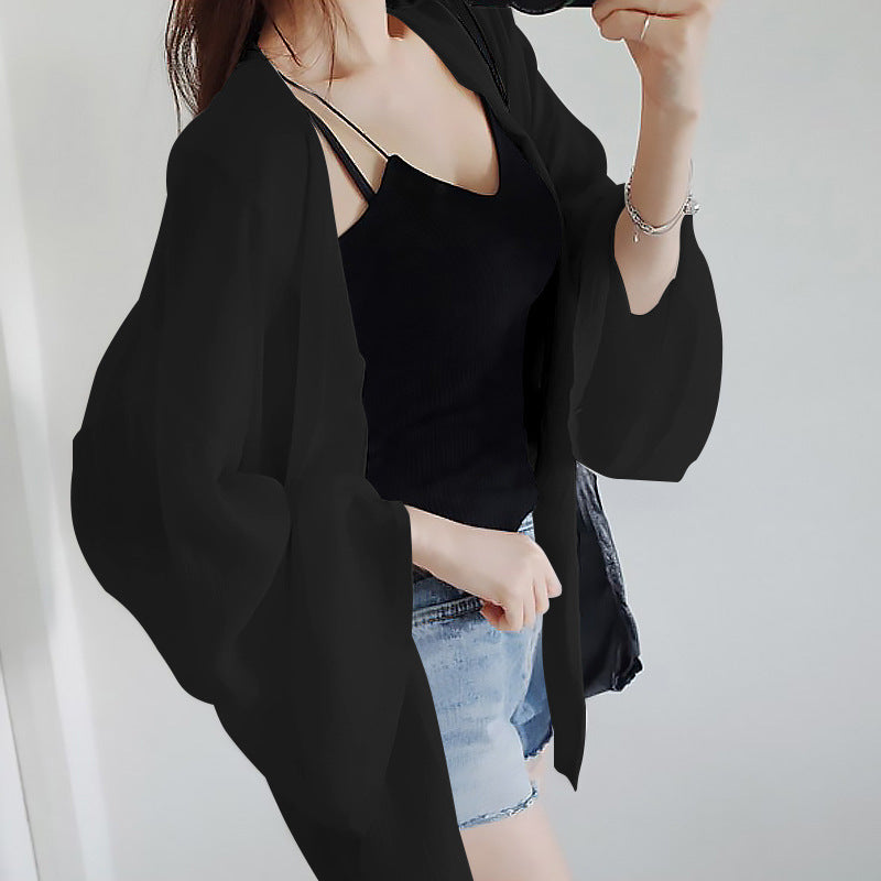 Ladies elegant kimono jacket with a loose fit and intricately designed sleeves