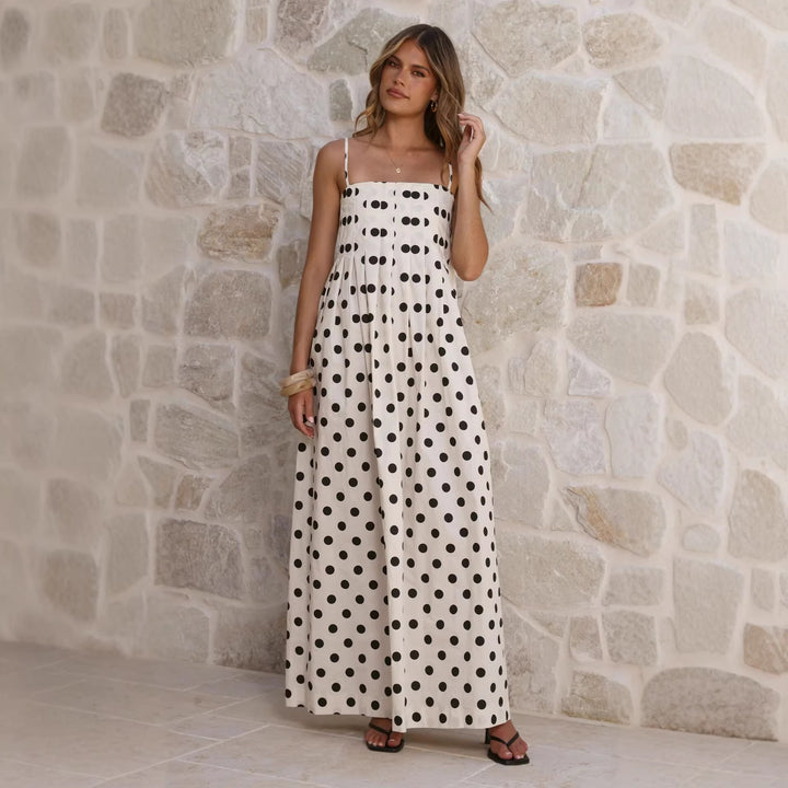 Women’s maxi dress with playful polka dot pattern and off-the-shoulder straps