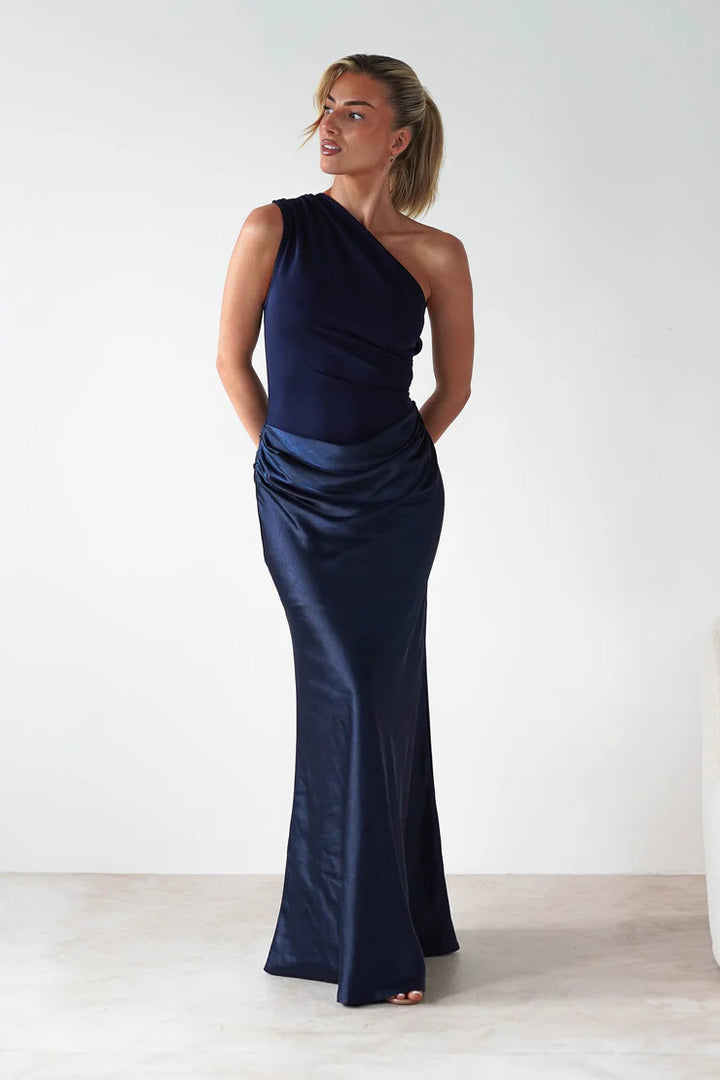 Women’s evening dress with asymmetrical cut and elegant draping design
