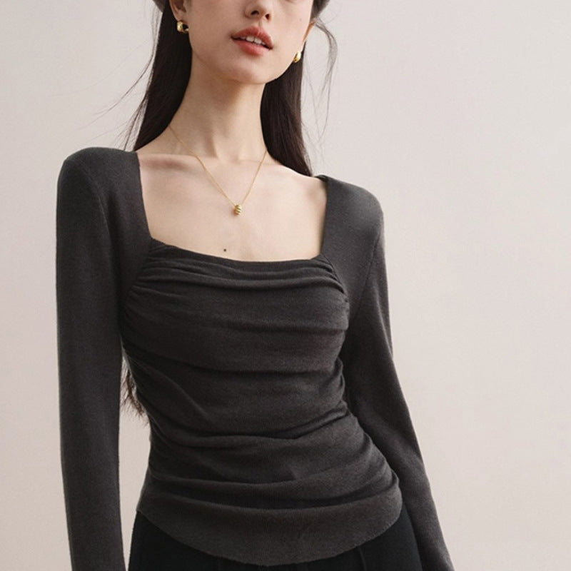 Women's fitted top with elegant gathering effect