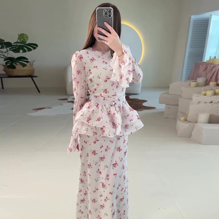 Women's maxi dress with voluminous peplum and floral accents