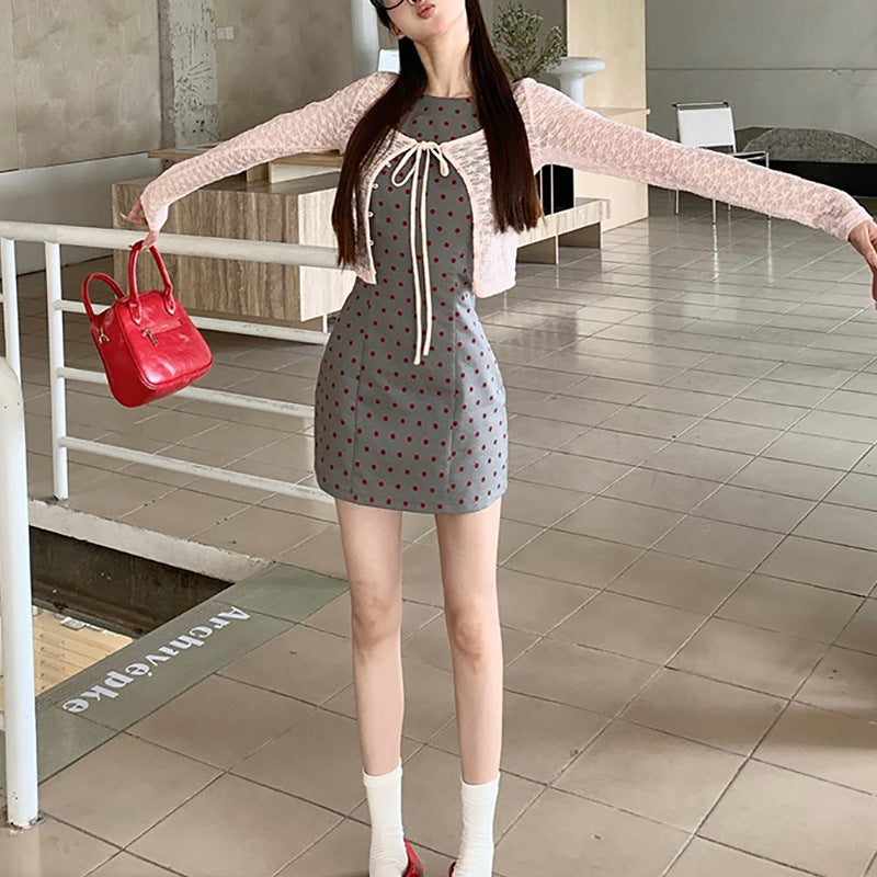Women's sheath dress with polka dot pattern and figure-hugging cut