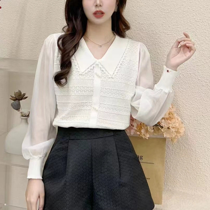 Women's blouse with lace collar and decorative buttons