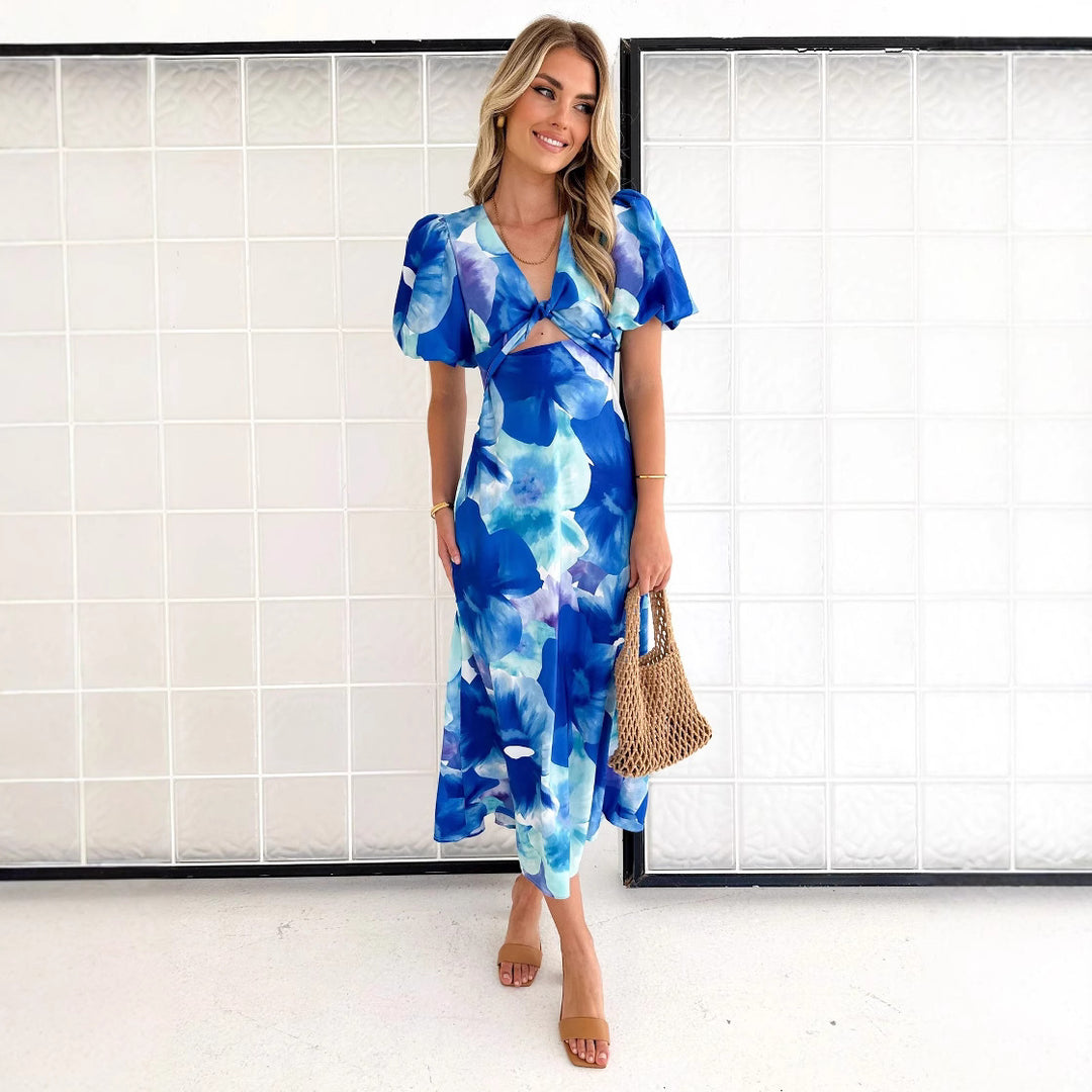 Women's maxi dress with floral accents and an eye-catching cut-out