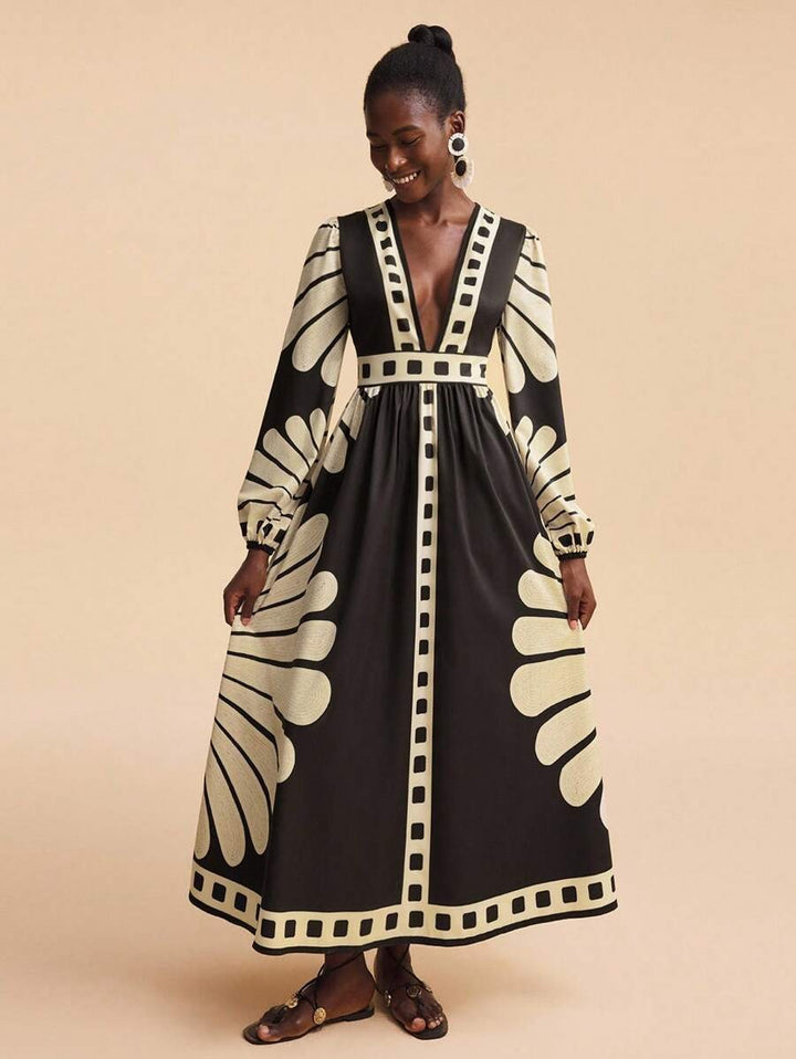 Women's maxi dress with deep V-neck and extravagant sleeve designs Lune London