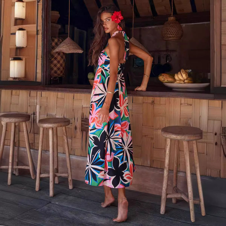 Women's maxi dress with floral bandeau design and elegant flared skirt