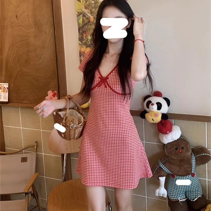 Ladies plaid mini dress with ruffle details and deep V-neck