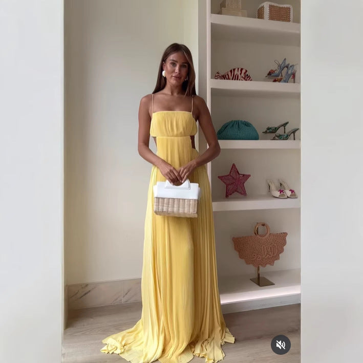 Women's maxi dress with elegant pleated details and thin spaghetti straps