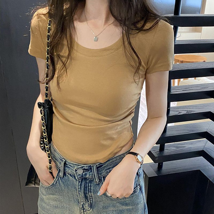 Women's fitted top with elegant round neck and delicate gathering effects