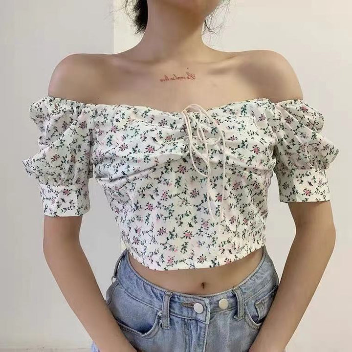 Women’s crop top with puff sleeves and floral design