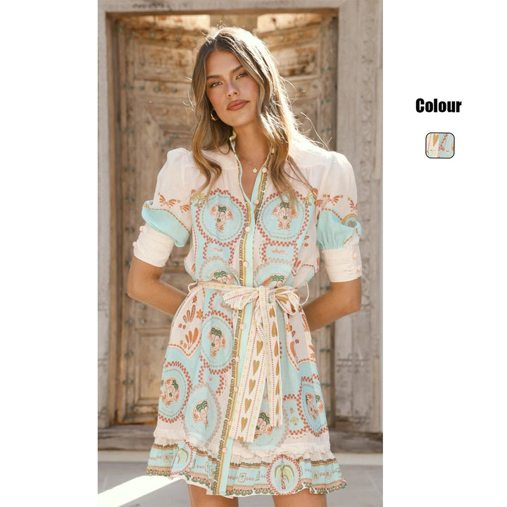 Women’s short sleeve dress with decorative button placket and playful ruffle