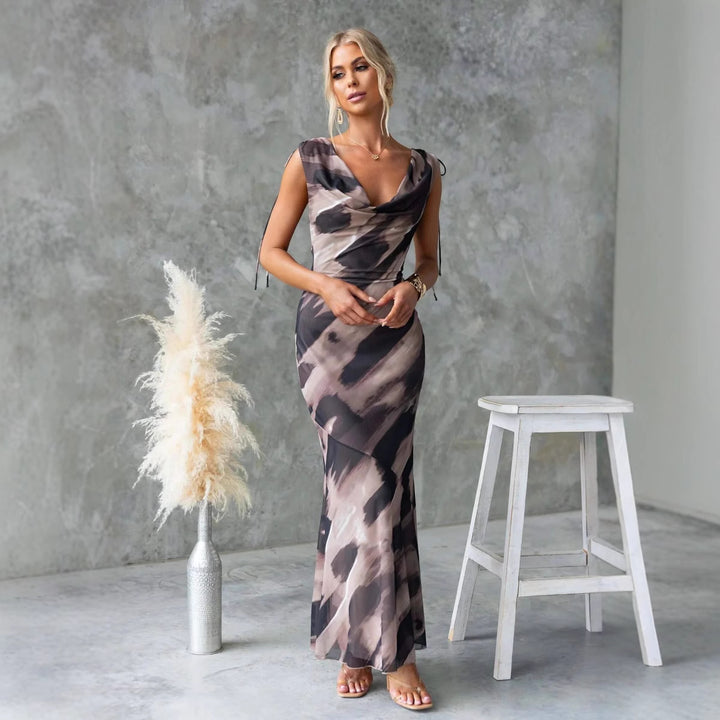 Women's maxi dress with elegant water neckline and floral accents