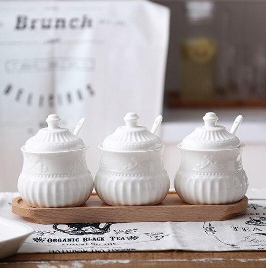 Lisslune | Elegant butterfly ceramic spice jar set with embossed designs, measuring spoons, and secure lids for stylish kitchen storage