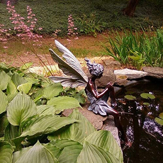 Lisslune | Statue of sitting fairy in the garden