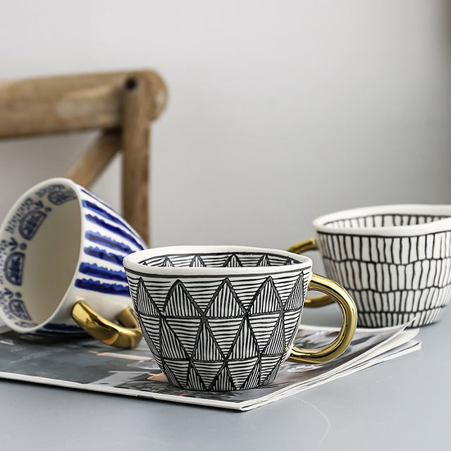 Lisslune | Cup with abstract geometric pattern and gold handle