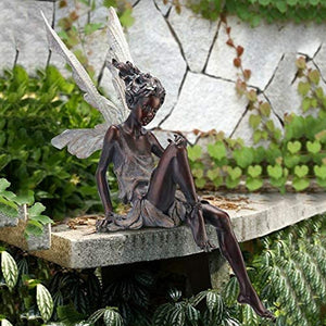 Lisslune | Statue of sitting fairy in the garden
